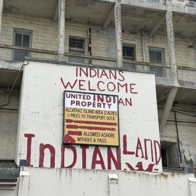 The dock building sign, with “Indians Welcome” and “Indian Land” painted in red during the occupation.