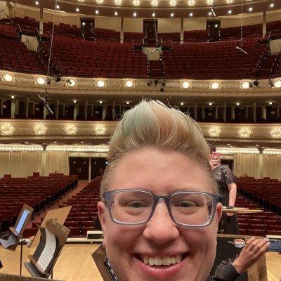 Andy taking a selfie on stage with the empty Symphony Center hall behind.